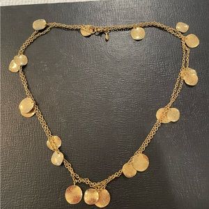 Premier Design gold necklace and earrings.